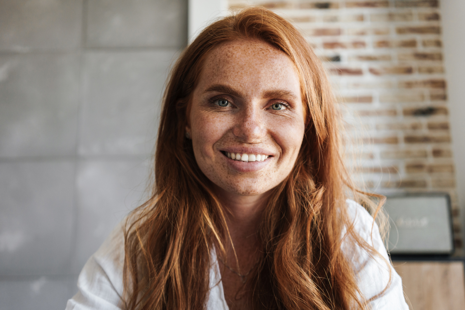 Image of Happy Ginger Woman with Freckles Smiling and Looking at Camera